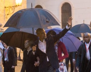 epa05223536 US President Barack Obama (front) waves upon his arrival to the Cathedral Havana, Cuba, 20 March 2016. US President Barack Obama arrives in Cuba for an official visit until 22 March to seal the process of rapprochement with the Communist-ruled island. Obama is accompanied by his wife Michelle, his daughters Malia and Sasha, and his mother-in-law Marian Robinson. The visit of Obama to Cuba from 20 to 22 March 2016 is the first visit of a US president to Cuba since US President Calvin Coolidge's visit 88 years ago. EPA/ROLANDO PUJOL